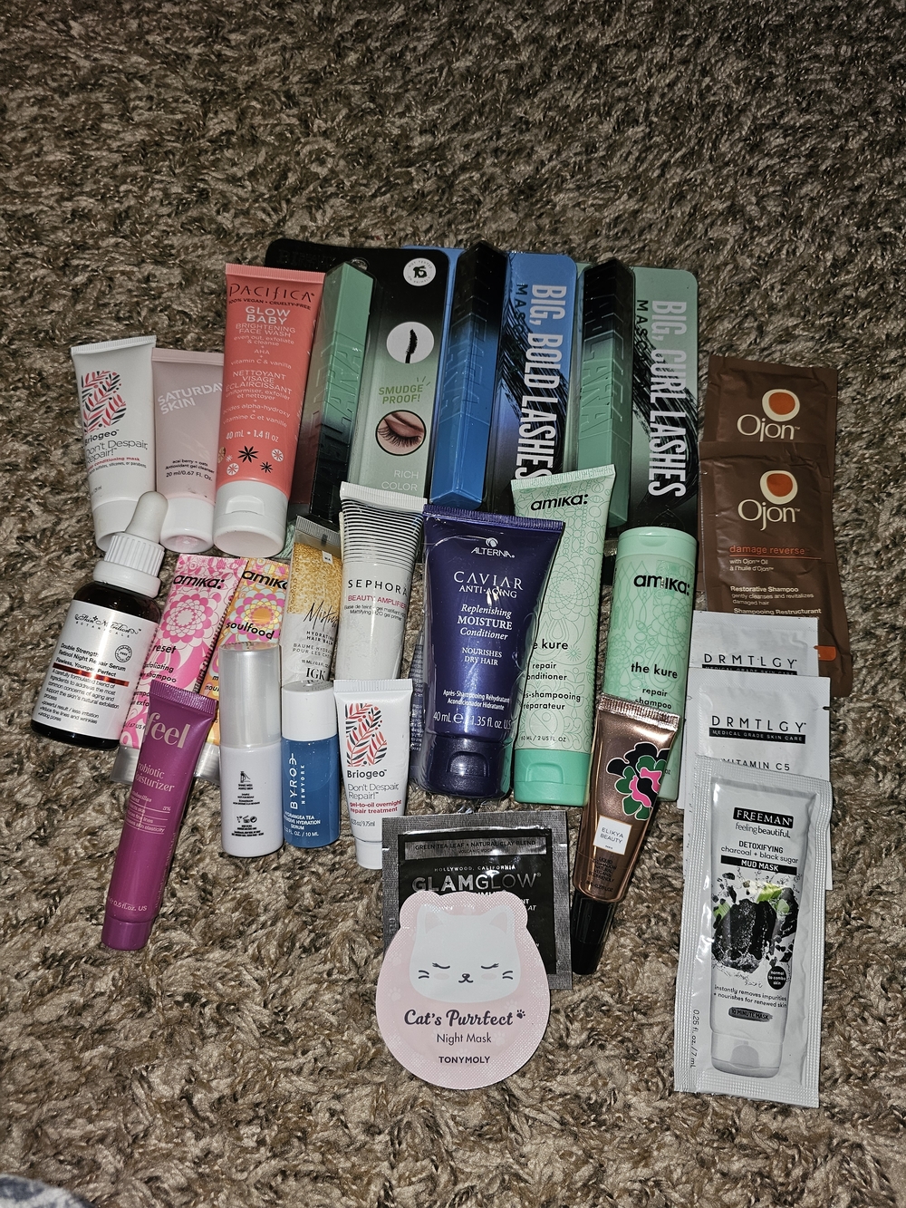 amika mint green and teal travel skincare & haircare assortment